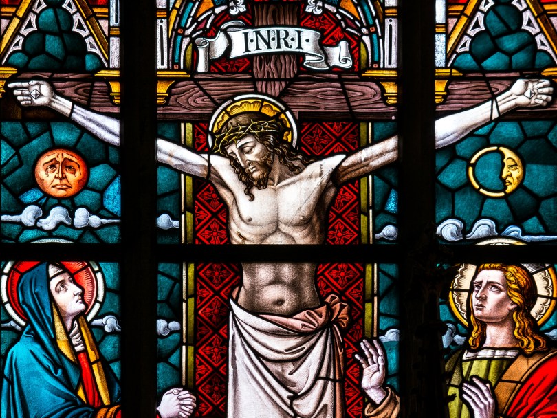 stained glass window depicting Jesus crucified, an apparent failure