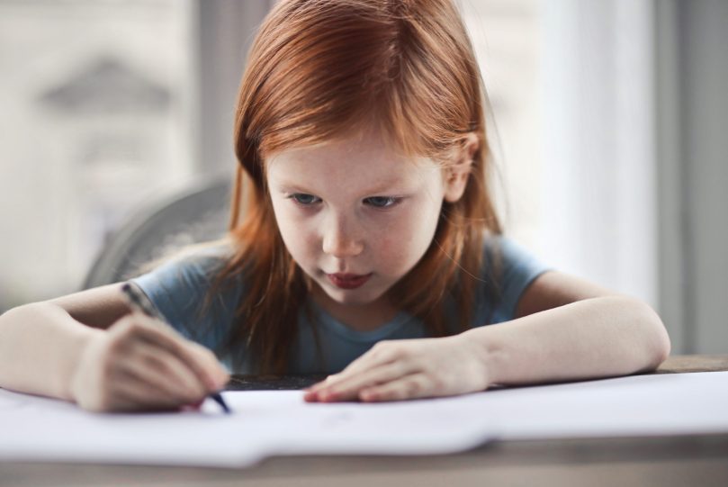 child in flow while writing or drawing