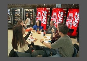 school cafeteria with vending machines in the background